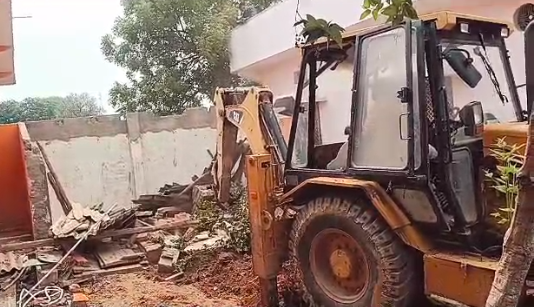 house destroyed by bulldozer