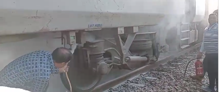 Smoke rises from the wheels of Himgiri Express